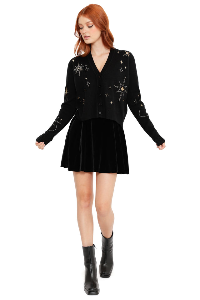 Statement black cardigan embroidered with gold stars and cosmic details for an elegant space-inspired look