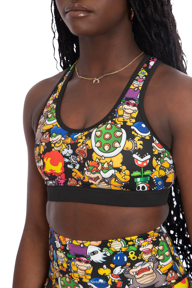 BlackMilk x Super Mario Enemies Cross Back Active Crop, black crop top with cross-back design featuring Bowser, Wario, Waluigi, Goombas, Bullet Bills, Koopa Troopas, Super Mario Merchandise, Collaboration apparel, Officially Licensed