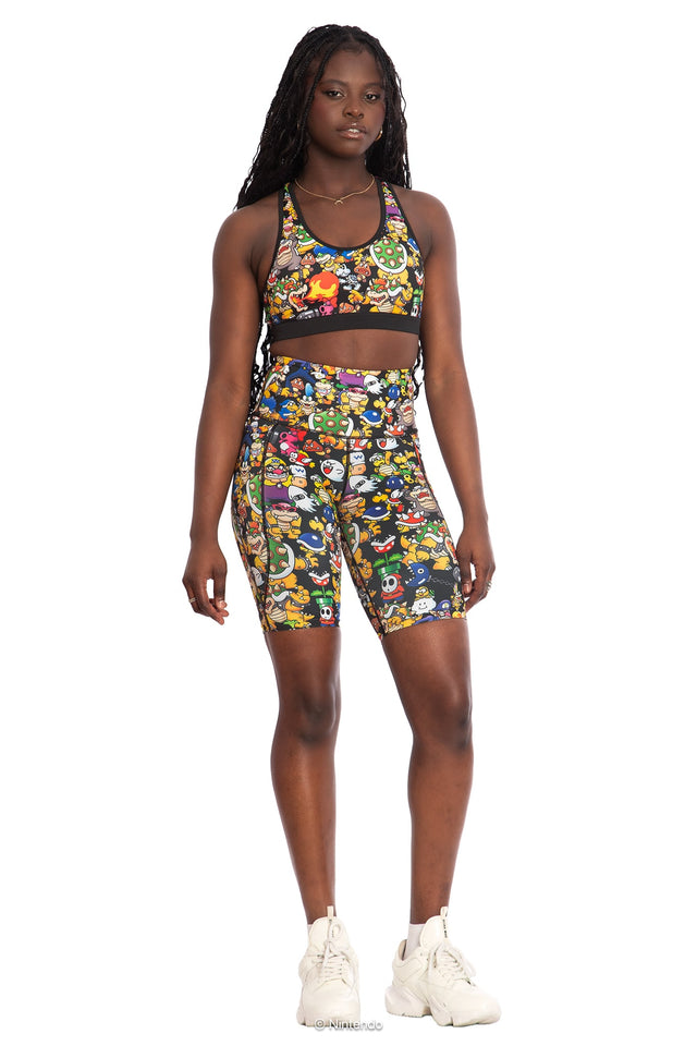 BlackMilk x Super Mario Enemies Cross Back Active Crop, black crop top with cross-back design featuring Bowser, Wario, Waluigi, Goombas, Bullet Bills, Koopa Troopas, Super Mario Merchandise, Collaboration apparel, Officially Licensed