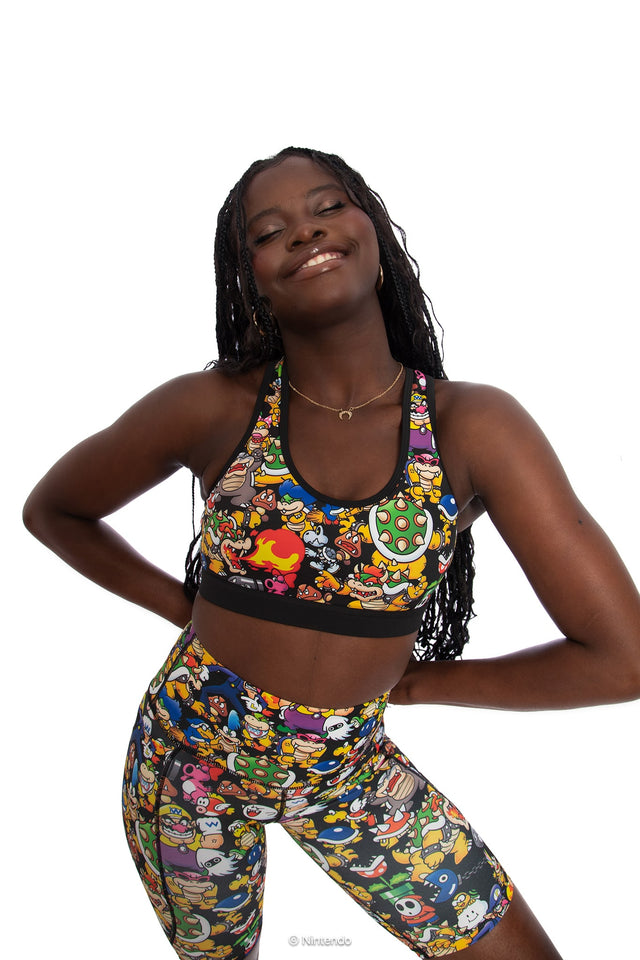 BlackMilk x Super Mario Enemies Cross Back Active Crop, black crop top with cross-back design featuring Bowser, Wario, Waluigi, Goombas, Bullet Bills, Koopa Troopas, Super Mario Merchandise, Collaboration apparel, Officially Licensed