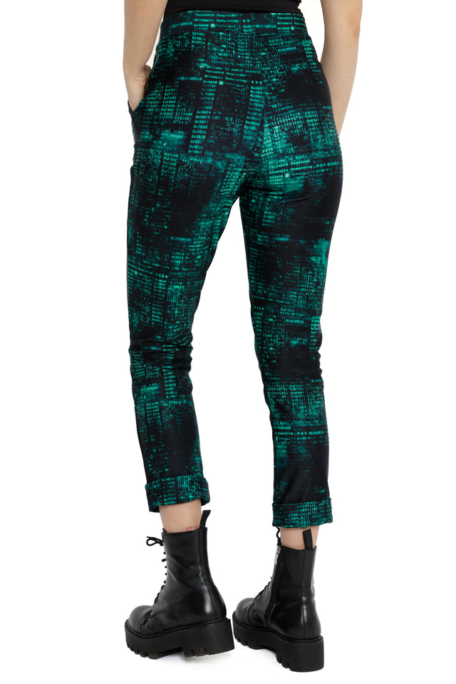 Fallout x BlackMilk black cuffed pants featuring glowing green Termlink code print inspired by Fallout hacking screens.