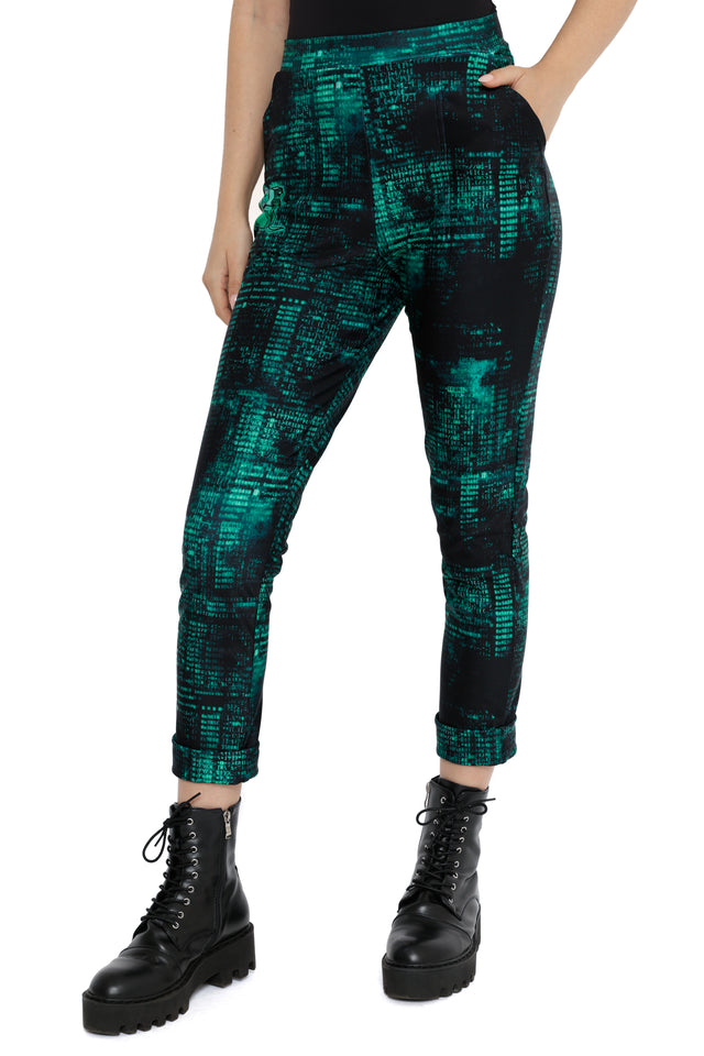 Model styled in Fallout x BlackMilk Termlink Hacking Cuffed Pants with green matrix-style Fallout pattern.