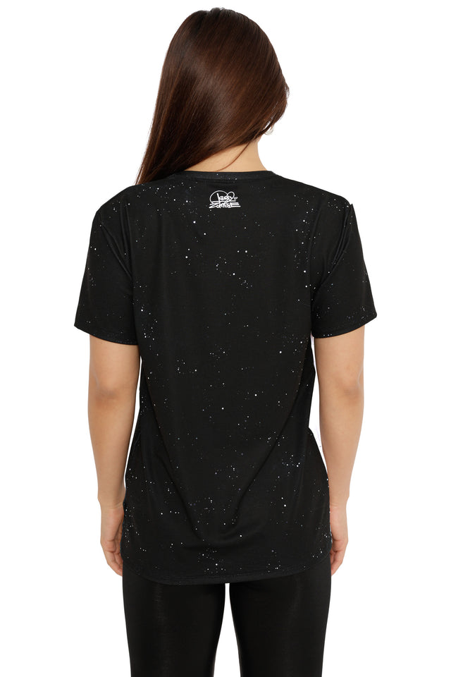 Person wearing a black t-shirt with a logo on the back against a white background