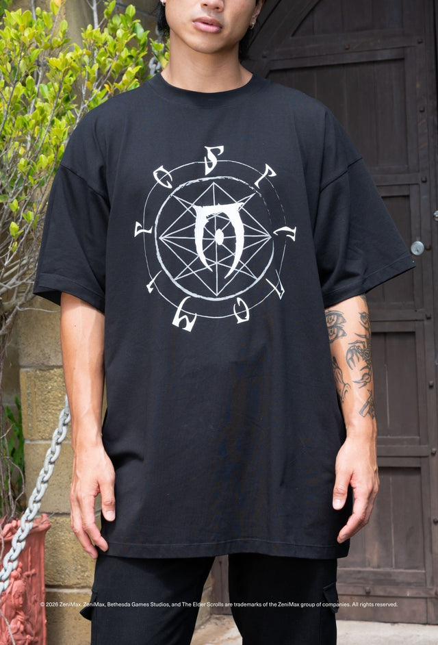 Elder Scrolls apparel oversized tee with Daedric script circle, black base and relaxed silhouette