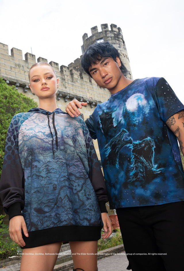 The Elder Scrolls fashion piece featuring oversized tee with Alduin dragon scene, short sleeves and soft draped fit