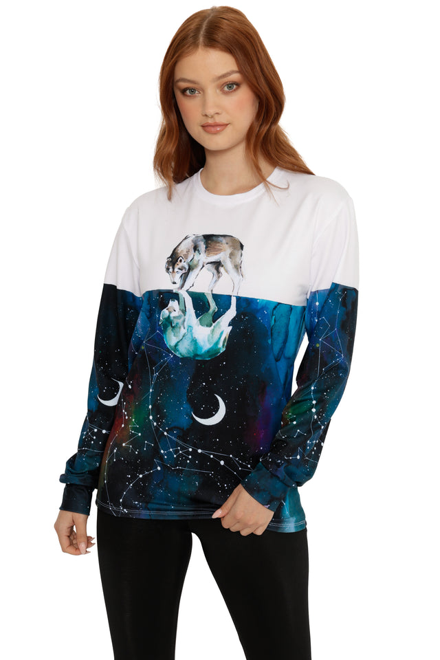 Woman wearing a long-sleeve shirt with a wolf design on a white background