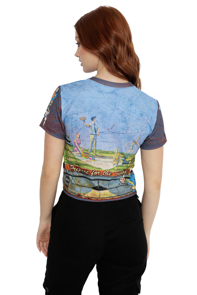 Fallout x BlackMilk blue and brown cropped Vault-Tec T-shirt with Vault-Boy and wasteland vault design.