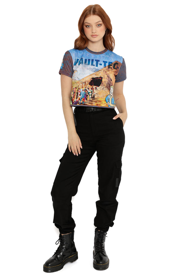 Model wearing Fallout x BlackMilk Vault-Tec Lunchbox Baby Tee featuring retro Vault-Tec poster print and Vault Boy graphic.