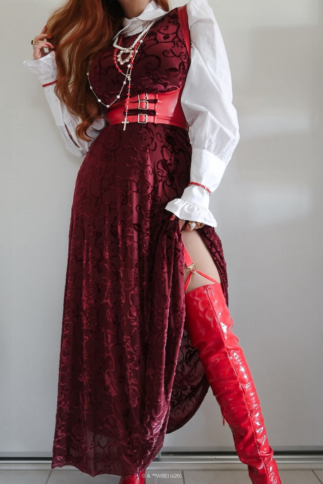 Close up styling of the Be With Me Always Black Cherry Burned Velvet Princess Maxi Dress from the Wuthering Heights collection, showcasing the velvet floral detailing and deep red tones