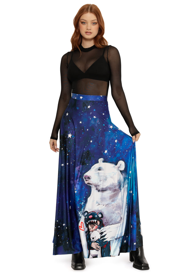 Woman wearing a black top and blue skirt with a polar bear design on a white background