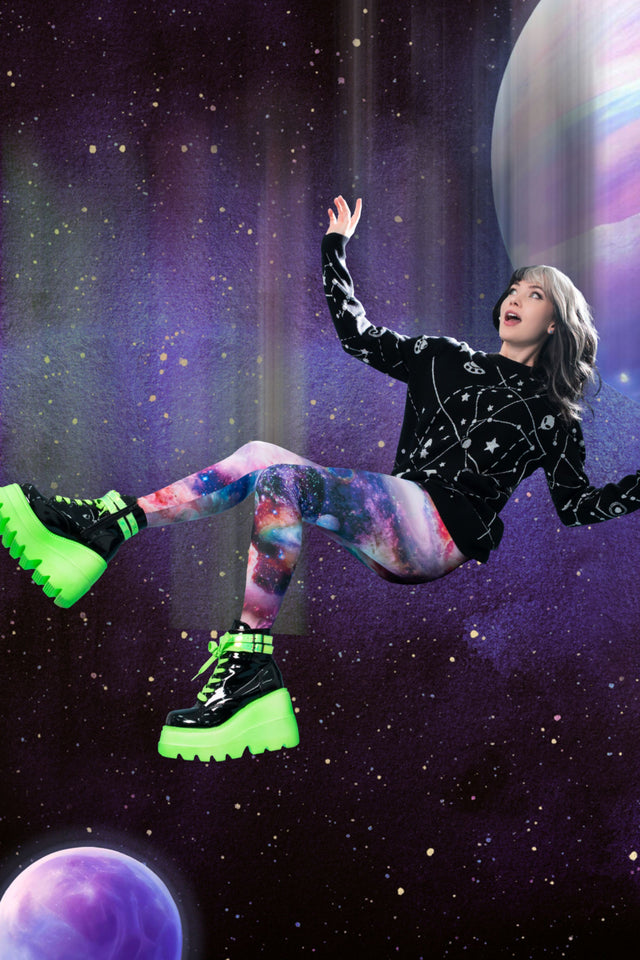 Black knitted jumper with white constellation print featuring stars, planets and playful alien motifs