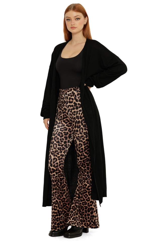 Black Super Cardigan styled open over a black top, showing its slouchy drape and oversized longline design.