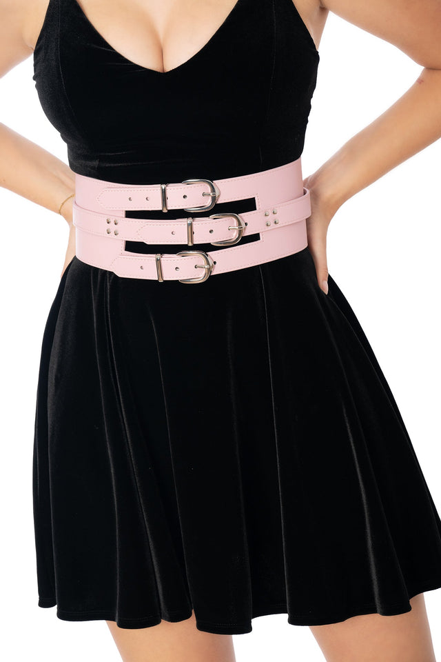 Model wearing pastel pink triple offset vegan leather belt - BlackMilk Lora Zombie wearable art fashion