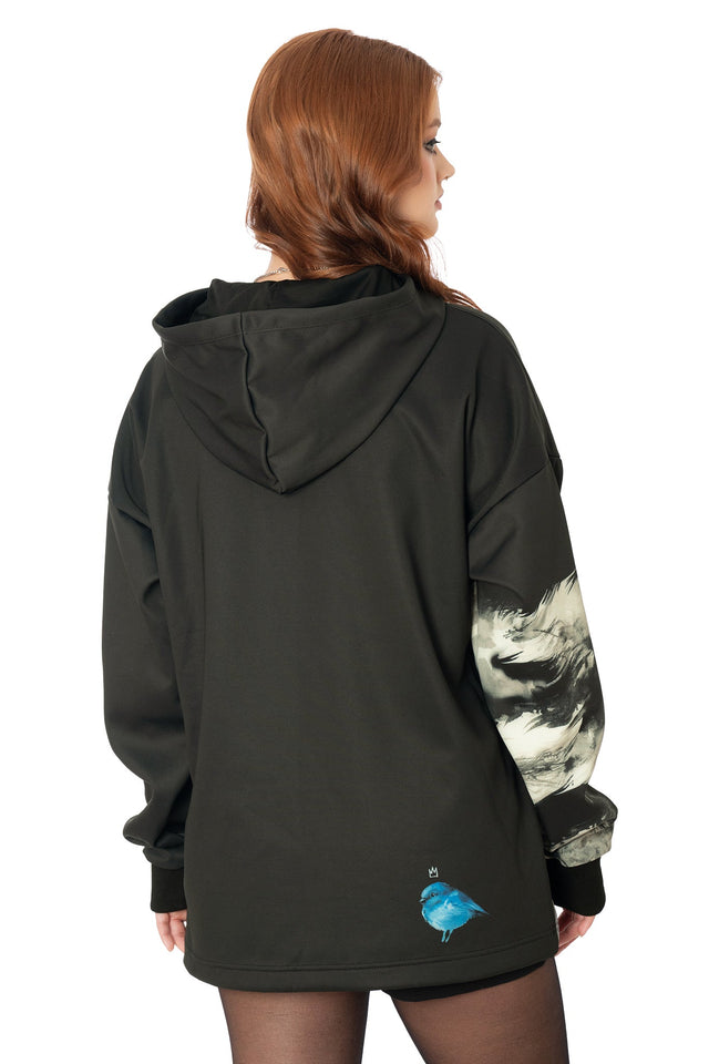 Model wearing black boxy oversized hoodie with Lora Zombie lion and bird artwork - wearable art by BlackMilk