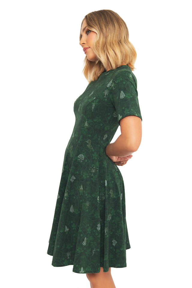 Side profile of the BlackMilk Lord of the Rings Bag End Wallpaper Longline Evil Tee Dress, showing the knee-length silhouette in a forest green hobbit-hole print.