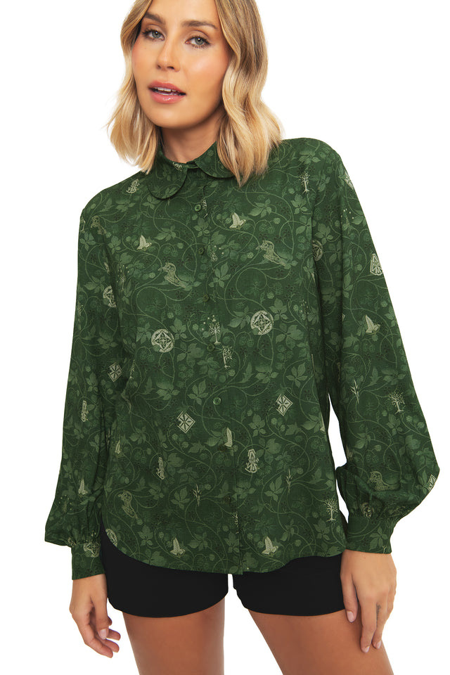 Detail shot of the botanical wallpaper-inspired print on the BlackMilk Bag End Long Sleeve Blouse, showing the fabric texture in deep green.