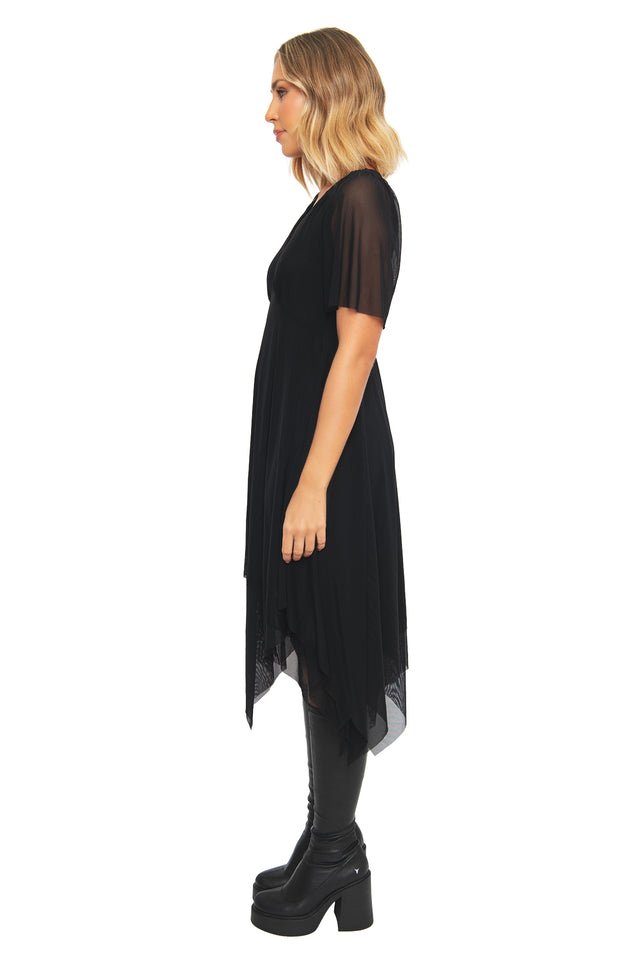 Movement shot of the BlackMilk Lord of the Rings Black Handkerchief Short Sleeve Dress, showing the asymmetric sheer mesh hem flowing in a gothic streetwear silhouette.