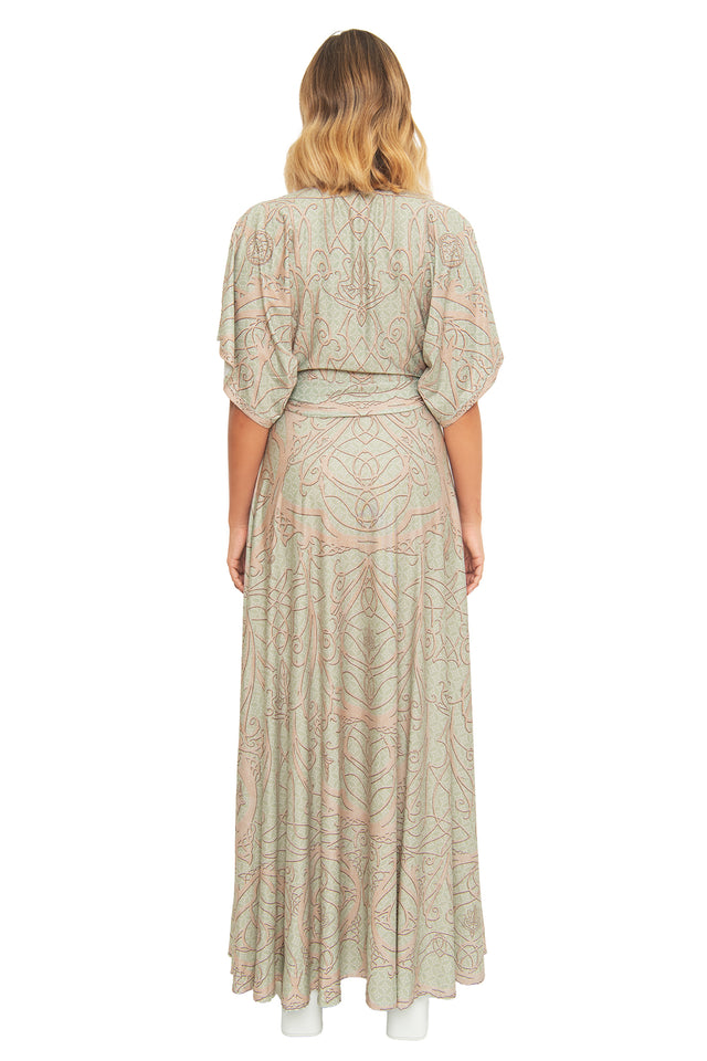 Back view of the BlackMilk Lord of the Rings Elves of Middle-Earth Maxi Dress, showing the tie-waist belt and intricate filigree print flowing down the maxi skirt.