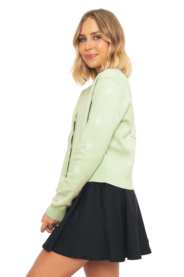 Side profile of the BlackMilk Fit For A Queen Knit Cardigan, showing the cropped silhouette and celestial star embroidery in pale sage green.