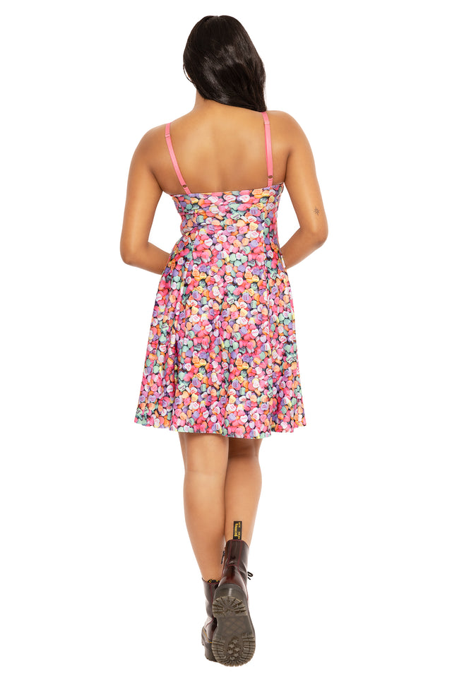 Colourful candy heart maxi dress with strappy design, combining a playful print and flowing silhouette for summer fashion, casual events, brunch dates and everyday outfits.