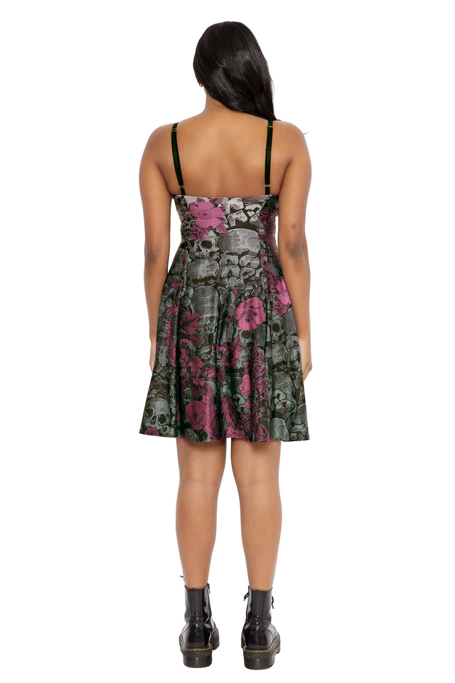 Whimsigoth floral longline dress with gothic skull details hidden beneath rich purple blooms and dark botanical textures. This alternative witchcore dress combines soft goth, dark fairycore and romantic gothic aesthetics with a sleek feminine silhouette.
