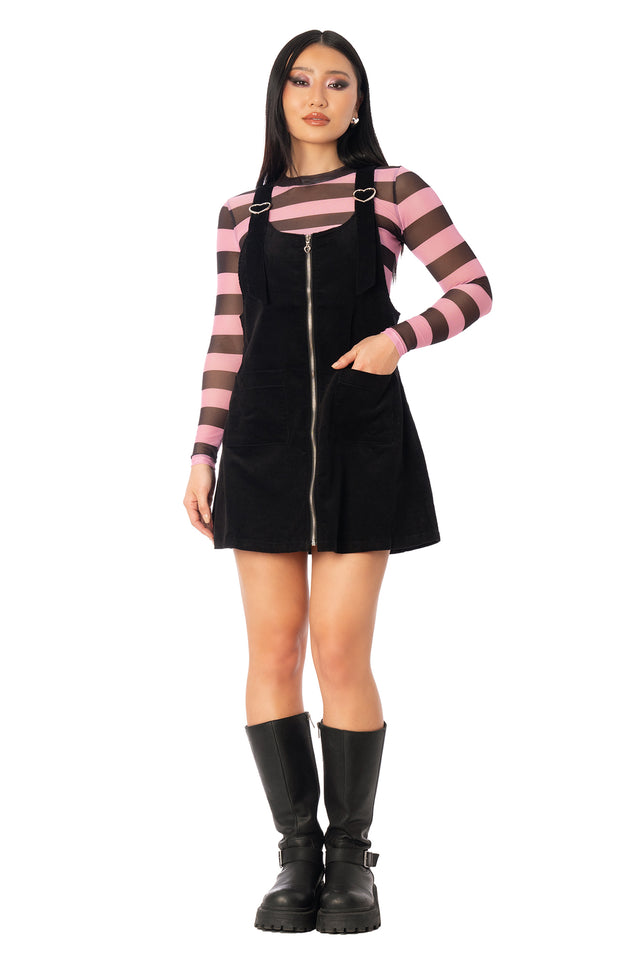 Additional product photograph 2 of the League of Legends K/DA x BlackMilk black corduroy pinafore mini dress with shoulder straps and a straight-cut silhouette.