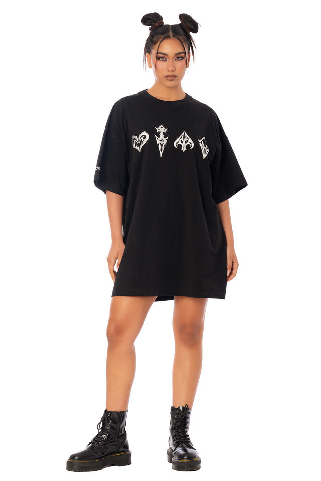 Model wearing the oversized black graphic tee as a T-shirt dress. League of Legends K/DA x BlackMilk oversized black cotton giant tee with a K/DA chromatic graphic print.