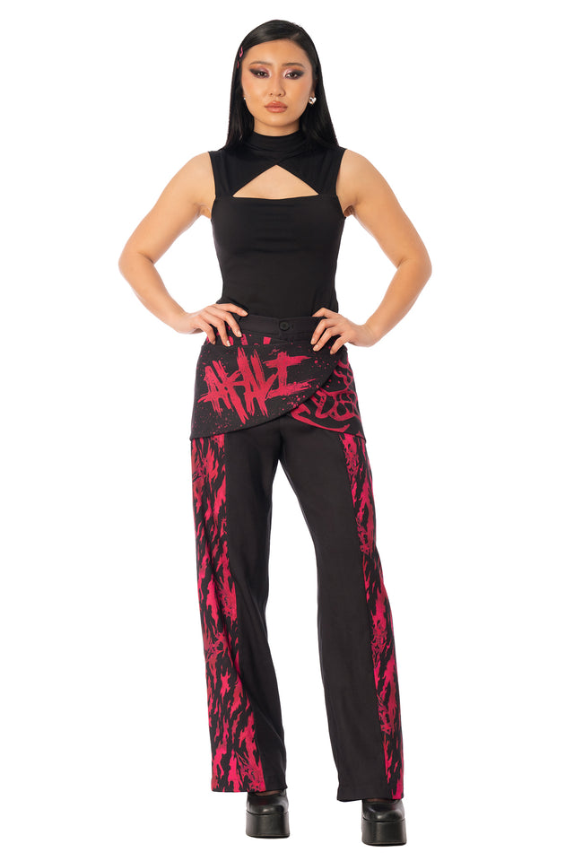 Additional product photograph 2 of the League of Legends K/DA x BlackMilk flowing black drape pants with red and pink Akali-inspired graphic print.