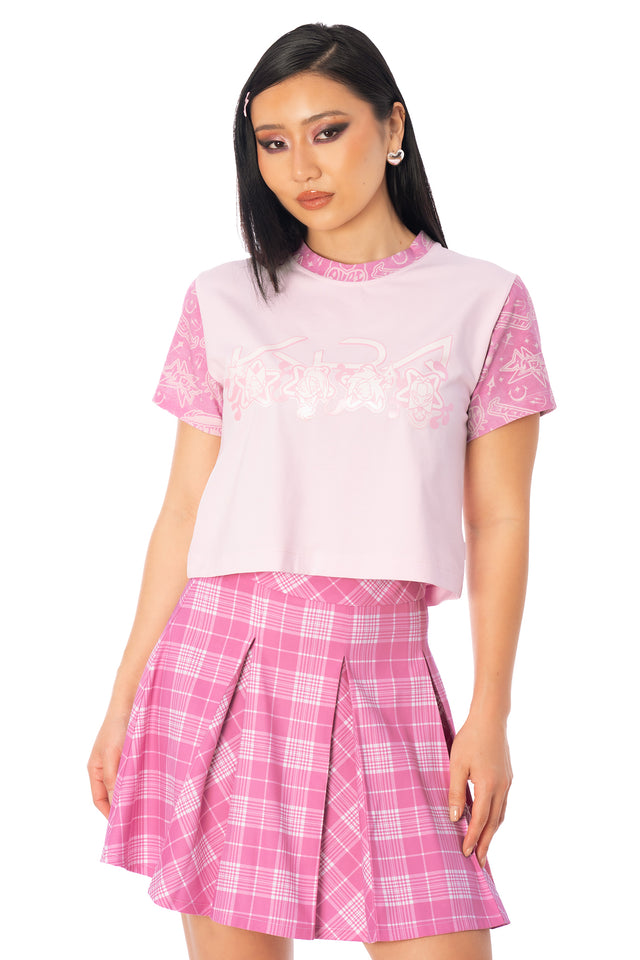 Additional product photograph 2 of the League of Legends K/DA x BlackMilk fitted pale pink cotton baby tee with pink sleeves and K/DA character symbols on the front.