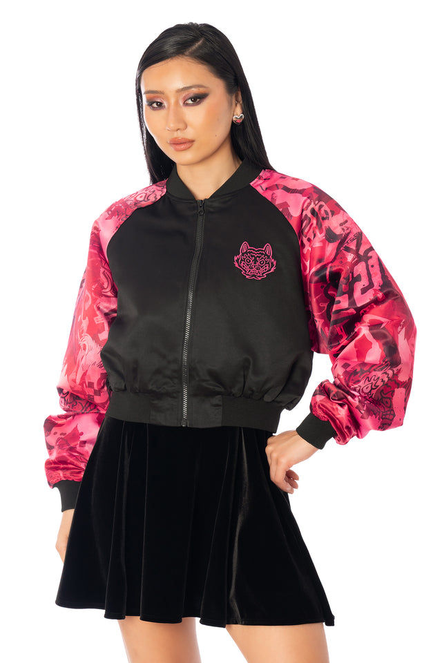 Additional product photograph 2 of the League of Legends K/DA x BlackMilk cropped black satin souvenir jacket with pink Akali tiger artwork on the back and contrasting patterned sleeves.