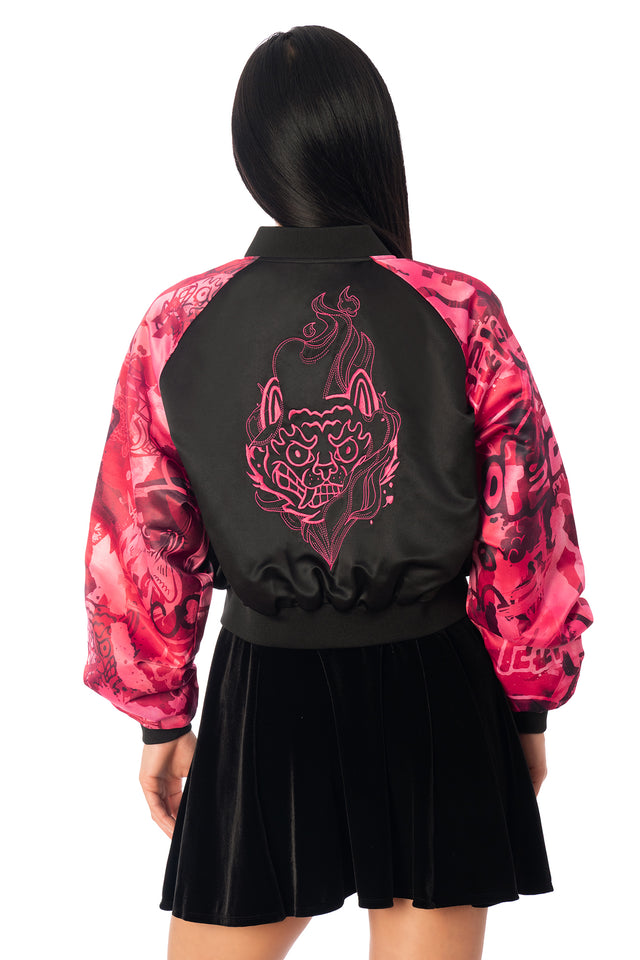 Additional product photograph 4 of the League of Legends K/DA x BlackMilk cropped black satin souvenir jacket with pink Akali tiger artwork on the back and contrasting patterned sleeves.