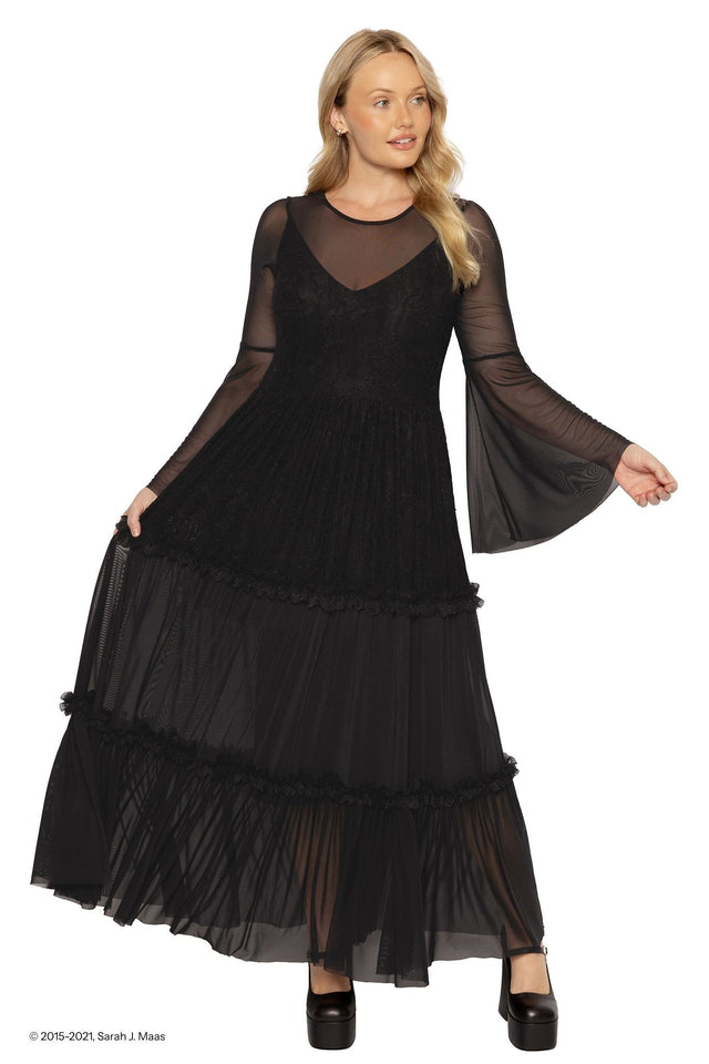 Model wearing a black lace maxi dress with a fitted bodice and flowing skirt, moving in soft light as the sheer lace and layered fabric create a dramatic silhouette, inspired by Amarantha from A Court of Thorns and Roses (ACOTAR).