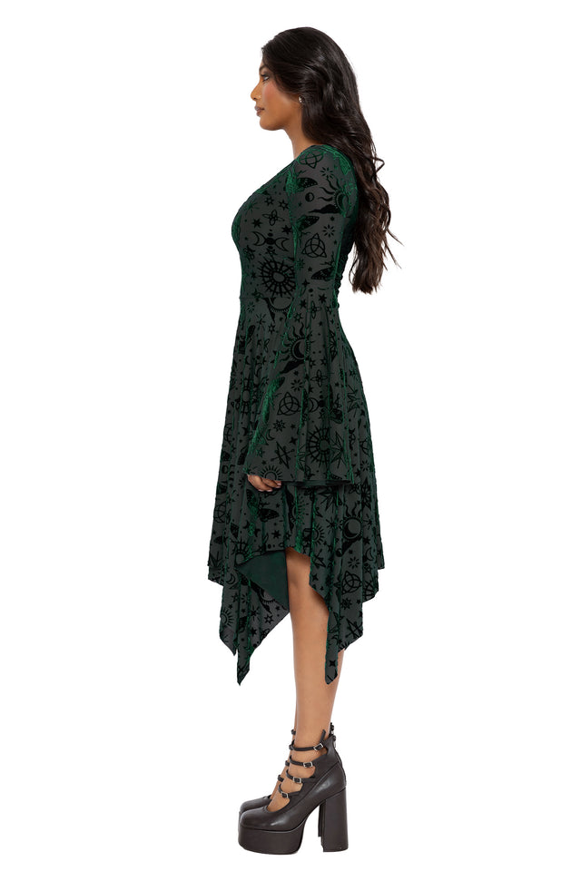Gothic burned velvet spectre dress with occult inspired artwork, sheer mesh layers and dramatic bell sleeves. Featuring a fitted bodice and asymmetric hemline, this alternative goth dress blends fantasy witch and dark academia fashion with elegant witchcore styling.