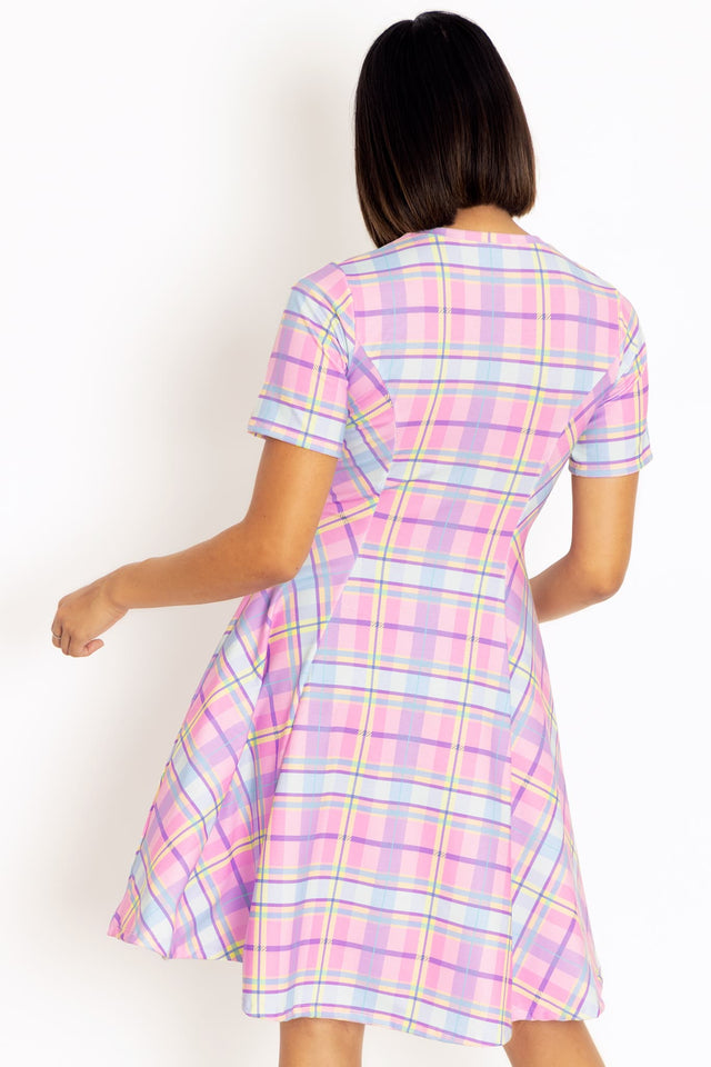 Longline tartan tee dress with oversized fit, designed for effortless comfort and versatile styling with boots, sneakers and layered looks.